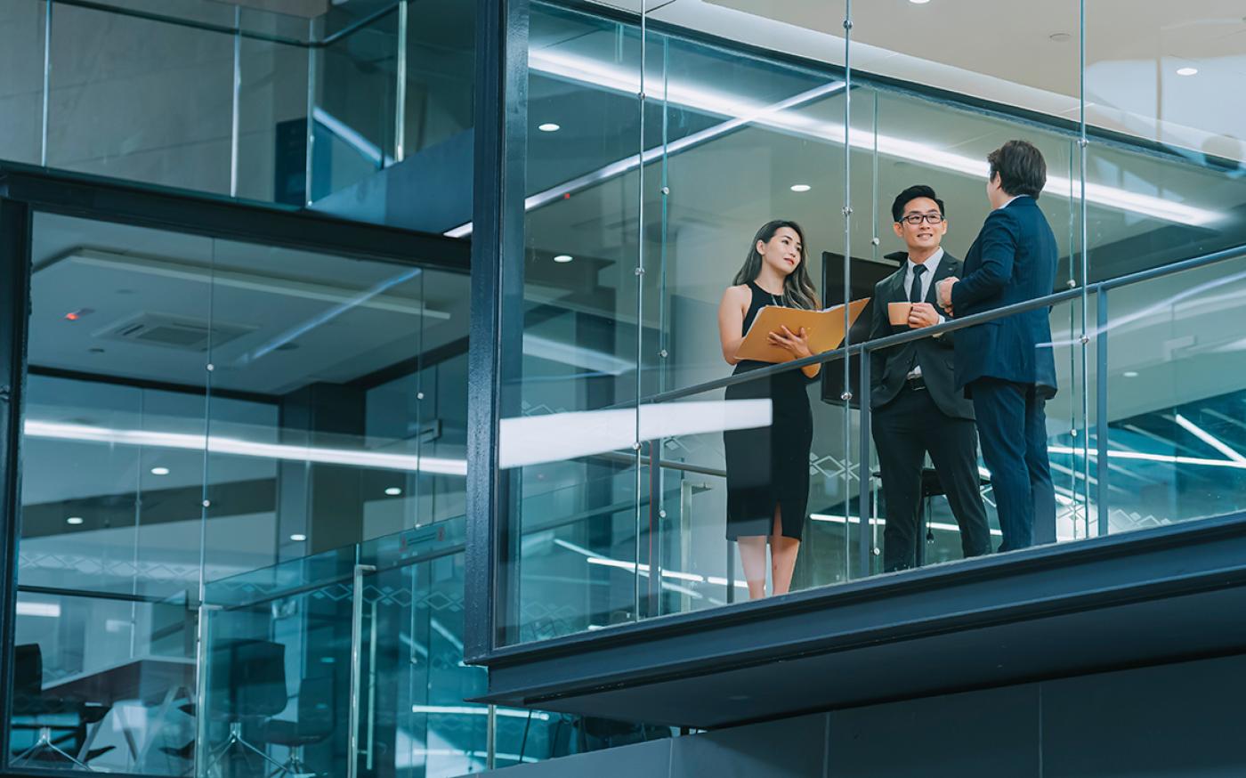 a group of business people chatting