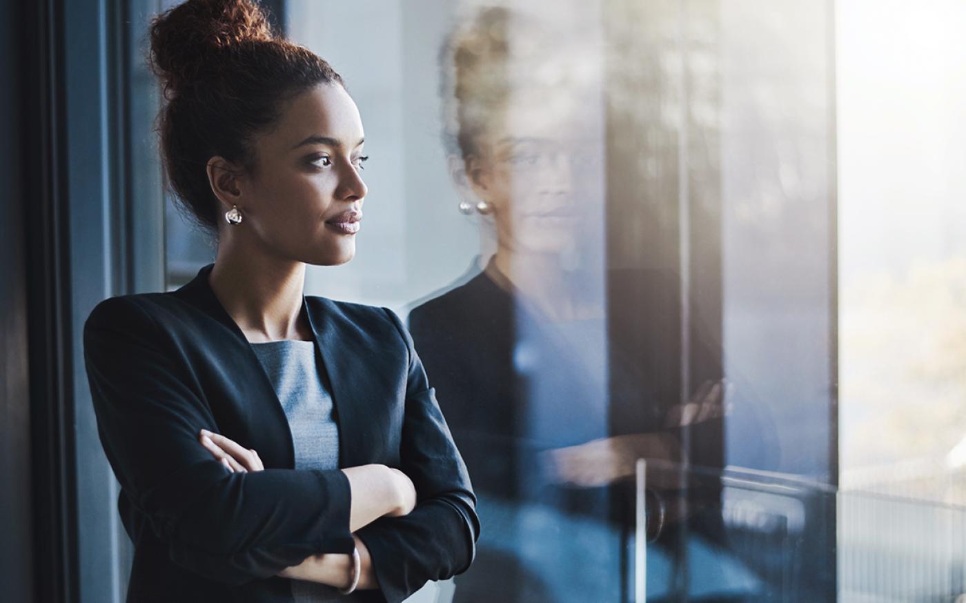 business woman looking outside window